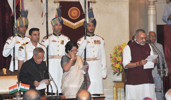 President Pranab Mukherjee administering the oath as Minister of State to  Giriraj Singh, at a Swearing-in Ceremony, at Rashtrapati Bhavan, in New Delhi on November 09, 2014. 